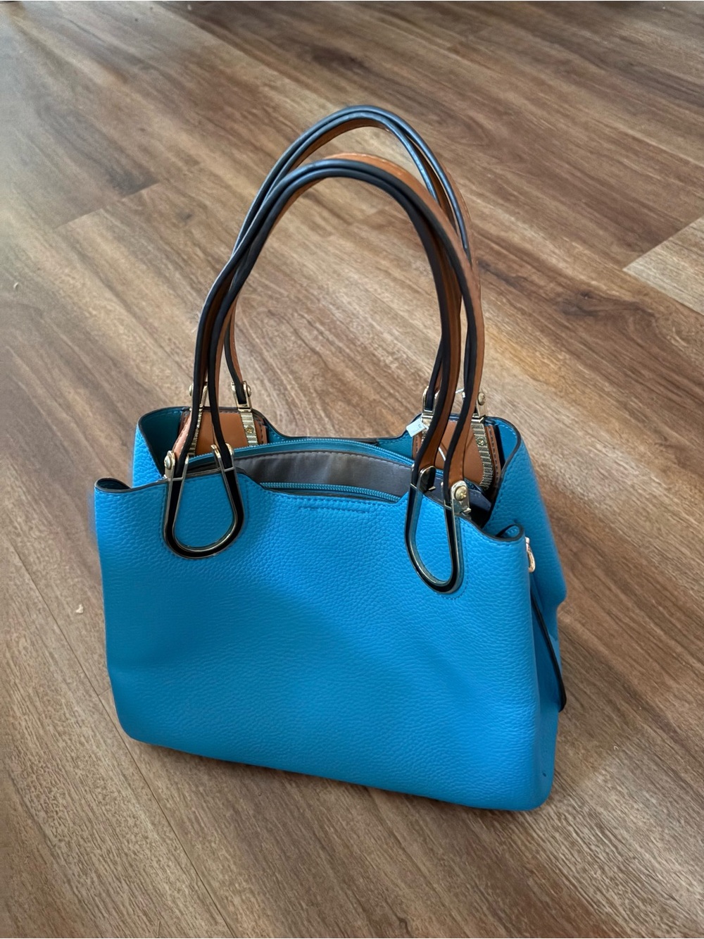 Bright Blue Pebbled Leather Shoulder Bag with Gold Accents